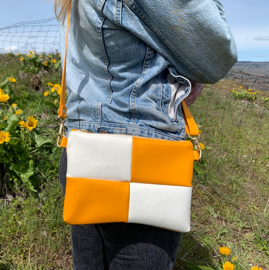 Close up of marigold yellow and white checker crossbody bag
